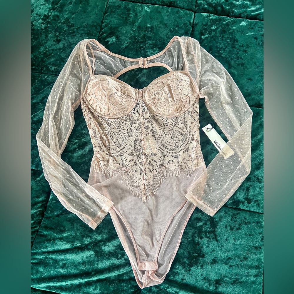 This is a beautiful one of a kind Lacey bodysuit
